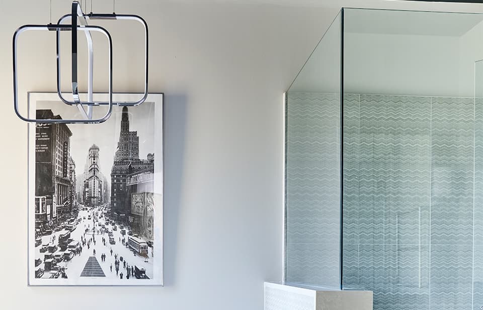 Luxury bathroom with chevron pattern tiles and ocean marble finishes